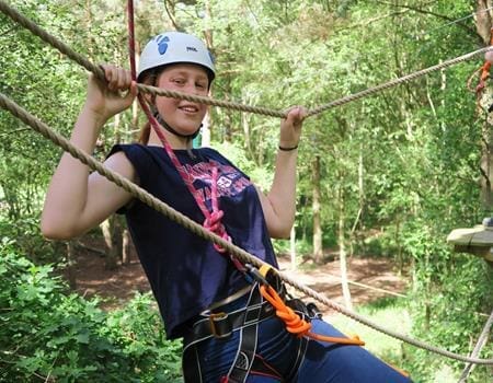 school pupil on a high ropes course at wild pines