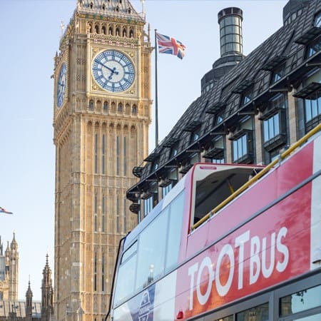 London bus by houses of parliament