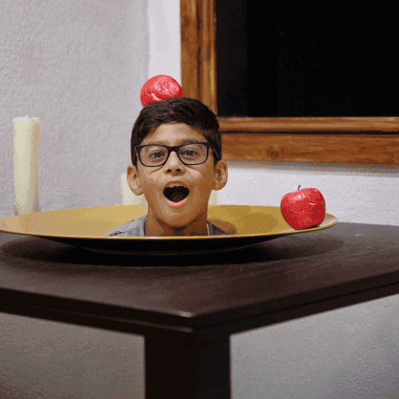 school pupils head showing through a TV at Paradox Museum London