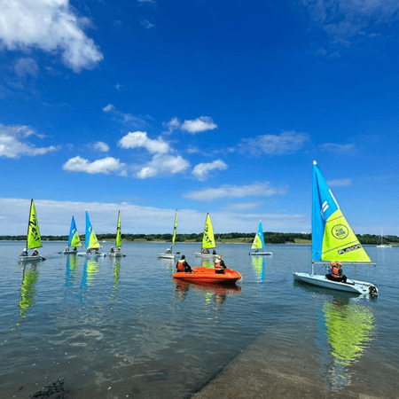 image depicts school group boating on a lake