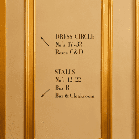 stage seating instructions on a wall at the theatre