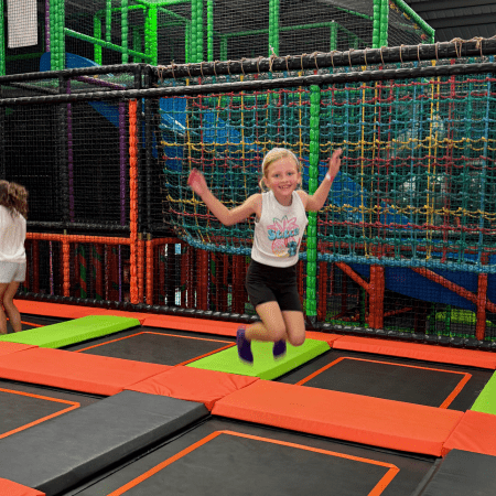 school pupil on an indoor trampoline