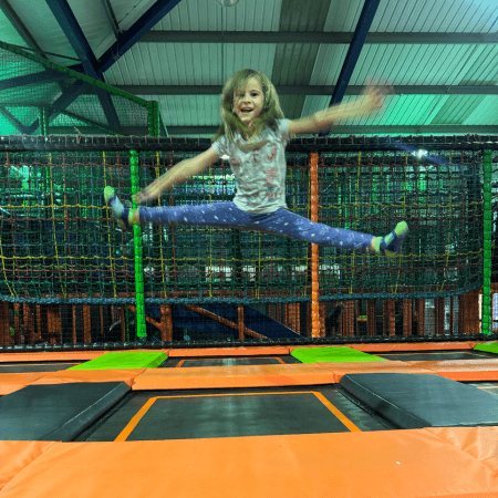 primary school pupil on an indoor trampoline