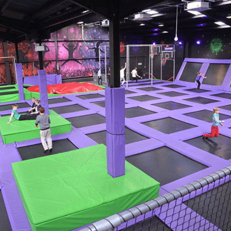 view of school group on multiple trampoline courts