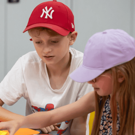 school pupils solving a puzzle at the videogame museum