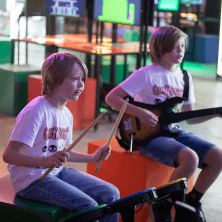 school pupils play instruments on a school trip at the National Videogame Museum