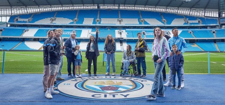 school group at a football stadium