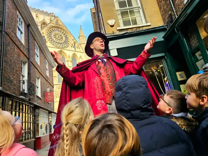 tour guide in a street in York doing the magical walking tour