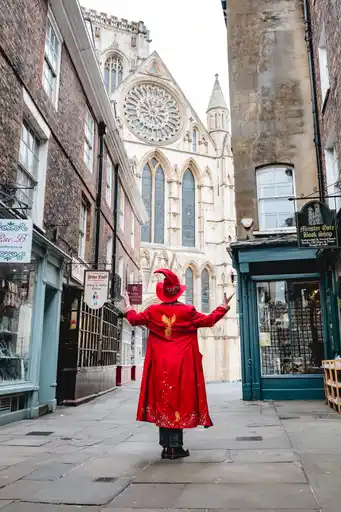 wizard of walk dressed tour guide dressed as a wizard in a small street in the city of York