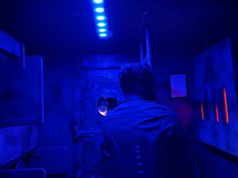 student in an indoor escape room