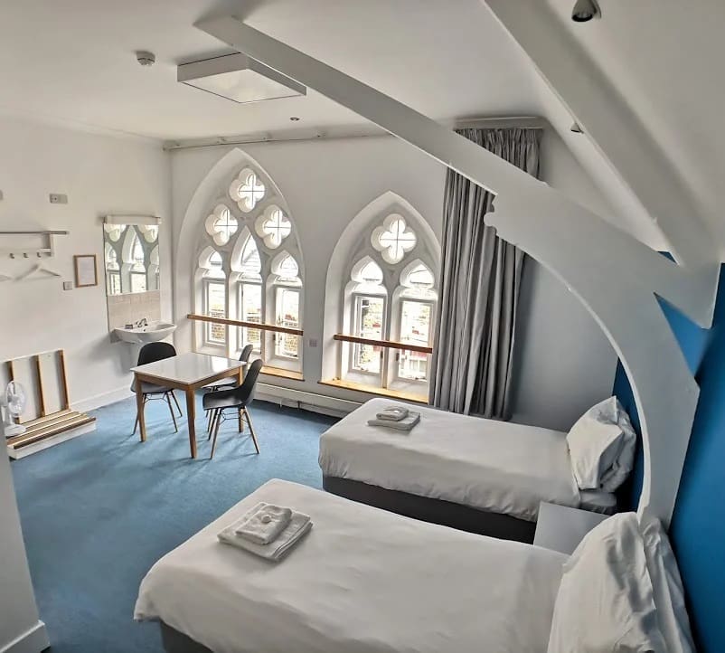 Kensington Gardens Hostel London 2 dorm room for school trip pupils to stay in with 2 beds, table and sink area