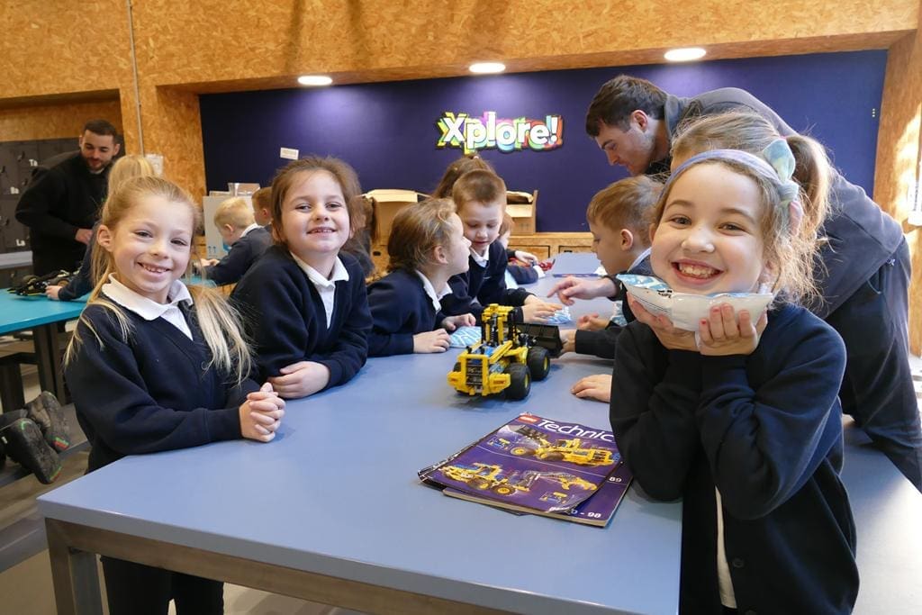Xplore! Science Discovery Centre North Wales 6 school pupils solving science puzzle at Xplore Science in Wales