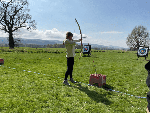 Belmont Outdoor Education Centre Scotland 7 school pupil in an archery field outdoors