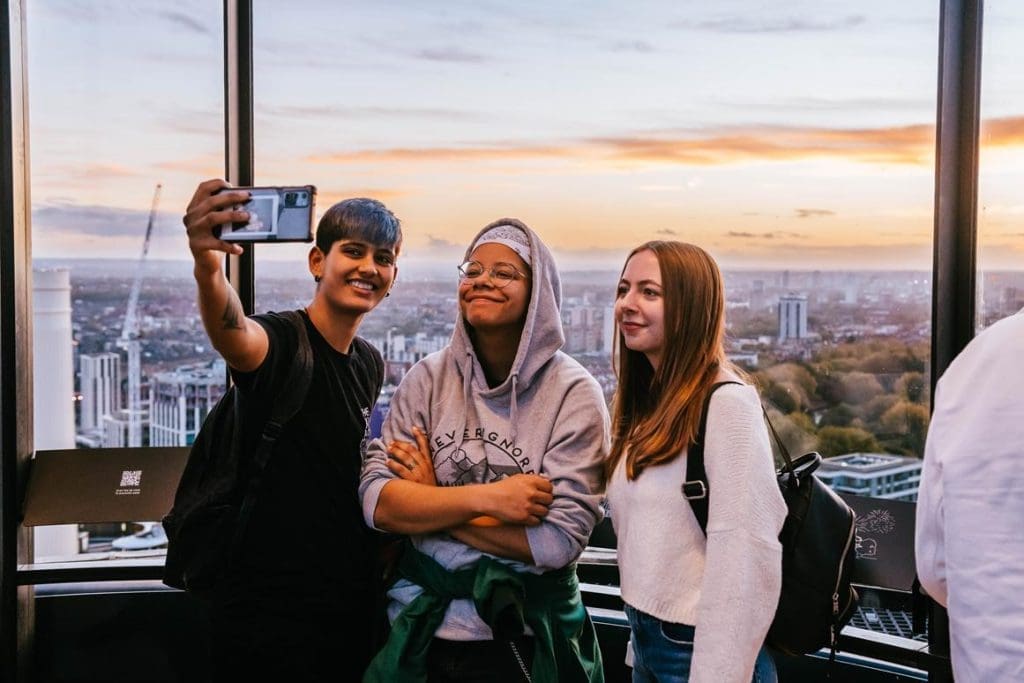 pupils at the top of the viewing tower taking a photo