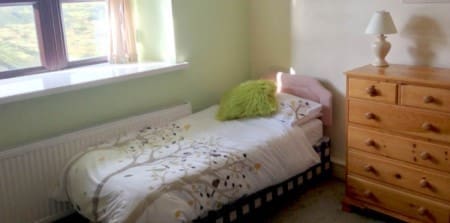 accommodation room showing bed and side table