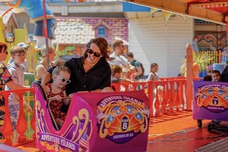 primary school children on a mini dodgems car