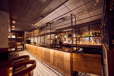 internal view of restaurant seating area with bar