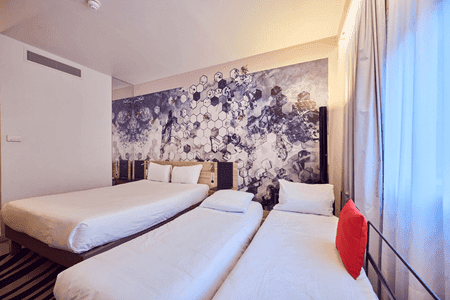 room with 3 beds