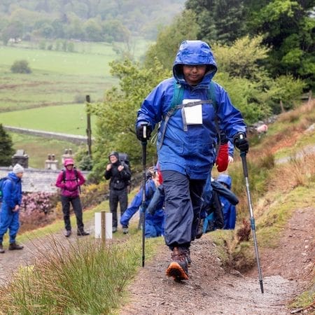 school group hiking with instructor in the lake district